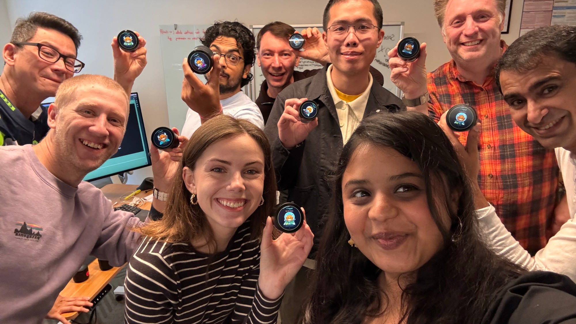The SageOx team holding OxDots